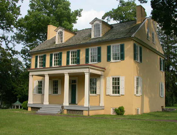 Federal-style house with green shutters